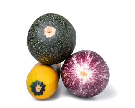 Two variations of zuchinni and an eggplant on a pile seen from underの写真素材