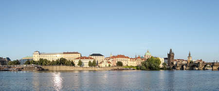 Panoramic view at Charles Bridge Prague Castle old town houses with red tegular roofs and broach tower and river Vltava Prague Czech Republicのeditorial素材