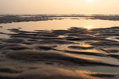 A Sunset on the beach on the French opal coast with sea and sand with structures. Copyspace. Horizonの写真素材