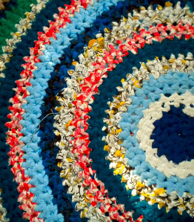 An image depicting a colourful crochet granny blanket.の写真素材
