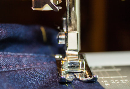 Sewing machine and jeans fabric  Focus on the needle 