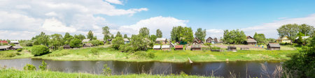 Beautiful panorama of Russian village on the river bank.の写真素材