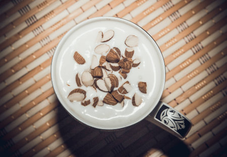 Cocktail with kefir in a cup. Added shredded almonds. View from above. For photos added noise.の写真素材