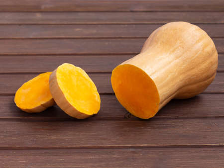 sliced pumpkin on a wooden table.の写真素材