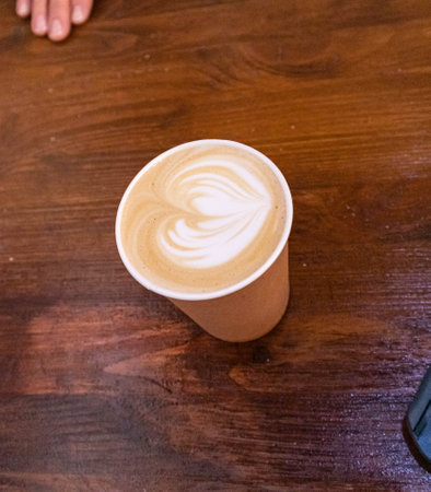 disposable cup with cream coffee to goの写真素材