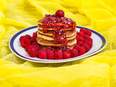 pancakes with ripe raspberries and raspberry jamの写真素材