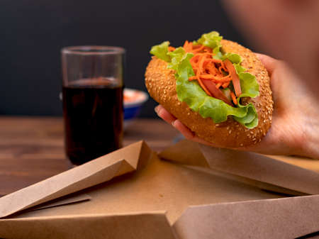 fresh hot dog in hand first person.の写真素材