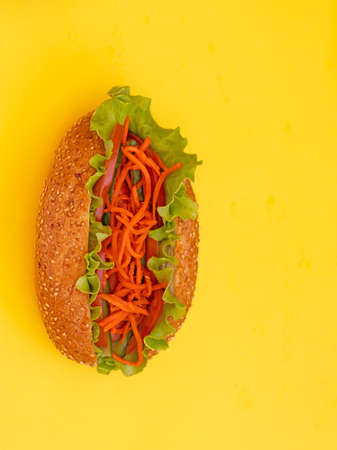 hot dog on a yellow background food deliveryの写真素材