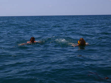 father and son swim in mon active recreationの写真素材