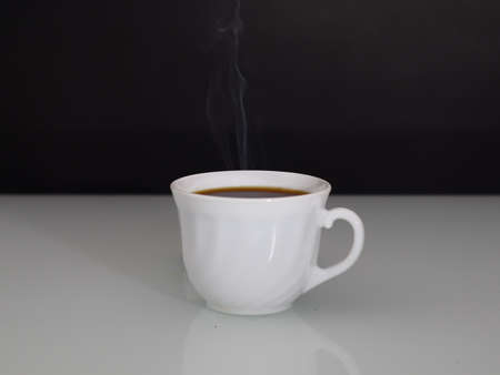 hot coffee steam on a dark background copy spaceの写真素材
