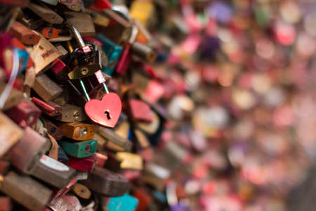 Heart lock in the middle of an ocean of locks
