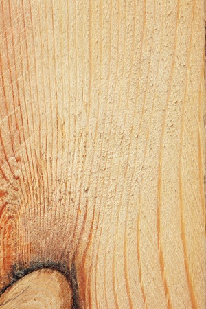 Background texture of a pine board with a knot, close-upの写真素材