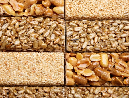 Honey bars with peanuts, sesame and sunflower seeds, close-up.の写真素材