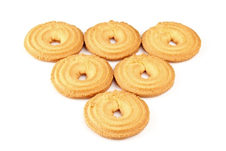 sugar cookies laid out a triangle apex downwards on a white backgroundの写真素材