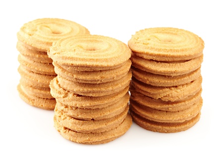 sugar cookies arranged in three stacks on a white backgroundの写真素材