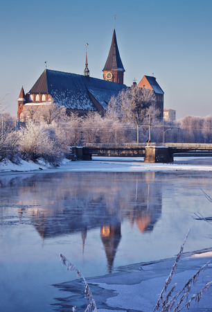 Konigsberg Cathedral in winter. View from the river Pregel. Reflection in water.の写真素材