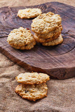 rustic still life with oatmeal cookies , the old board and burlapの写真素材