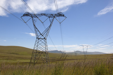 High voltage power lines running through open grassland habitat  の写真素材