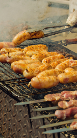 Grilled sausages on the grill. Vertical shot.の写真素材