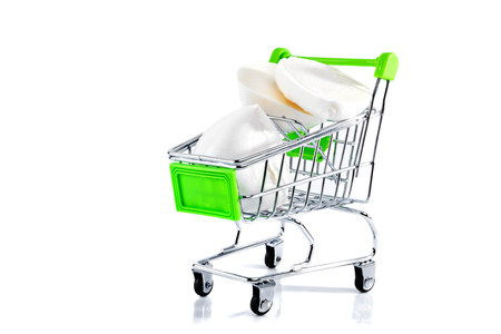 Mozzarella in metal shopping cart isolated on white background. の写真素材