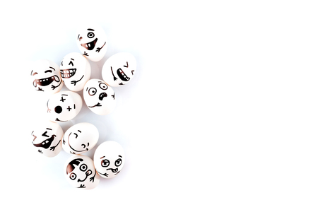 Funny easter eggs with different funny faces on white background.の写真素材