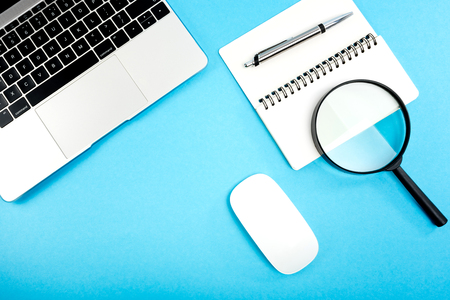 Modern workplace on blue table.の写真素材