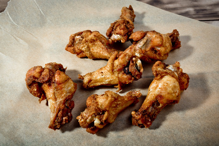 Bbq chicken wings on parchment paper.の写真素材