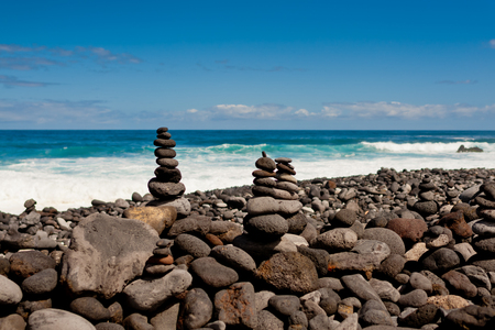 Stack of stones on the sea beach. Tenerife.の写真素材