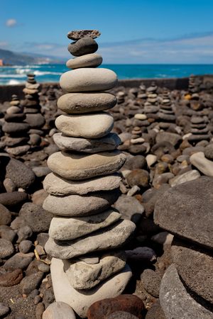 Stack of stones on the sea beach.の写真素材