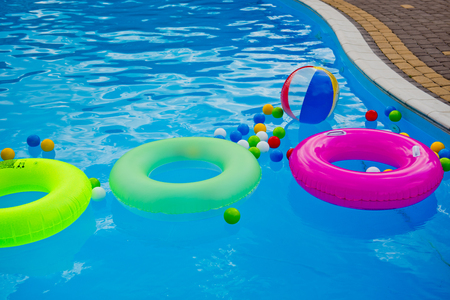 Diferent float accessories for swimming in the pool.の写真素材