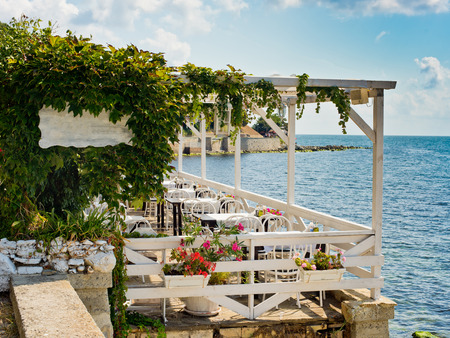 Summer empty cafe by the sea.の写真素材