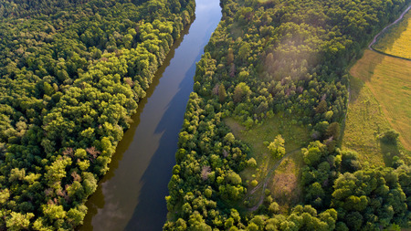 Aerial view of fields, forest, river, a beautiful landscape of nature.