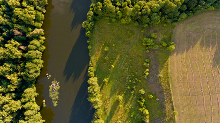Aerial view of fields, forest, river, a beautiful landscape of nature.の写真素材