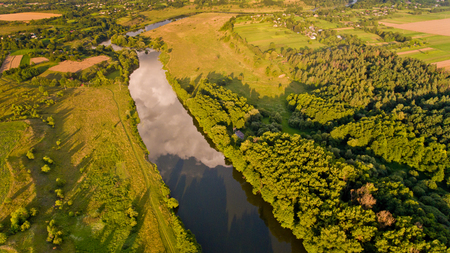 Aerial view of fields, forest, river, a beautiful landscape of nature.の写真素材