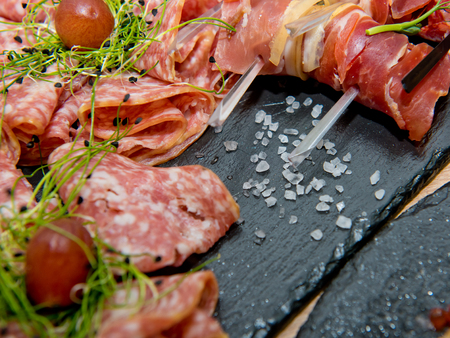Meat and sausage cutting. Close-up.