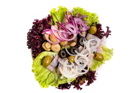 Herring fillet salad with olives, onion and pickled champignon isolated on white. Top view.の写真素材