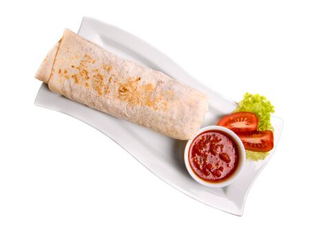 Eastern traditional shawarma plate with sauce isolated on white. Top view.の写真素材