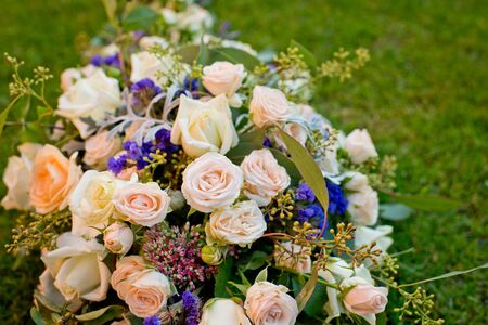 Wedding bouquet on a green grass in the park. Close-up.の写真素材