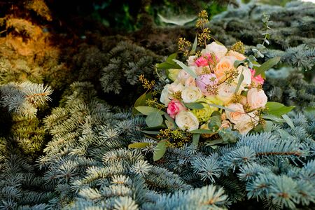 Wedding bouquet on a green bush.の写真素材