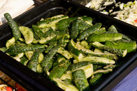 Pickled cucumbers on the counter.  Close-up. Street food festival. Selective focus.の写真素材