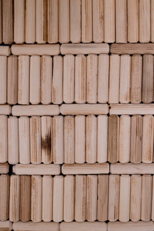 View of a grouping of wooden dowels as background. close-up.の写真素材