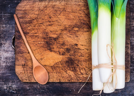 Leek on chopping board text space.の写真素材