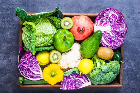 Winter vegetables and fruits in rustic wood box top view.Healthy eating, cooking.Organic winter farm vegetables.の写真素材