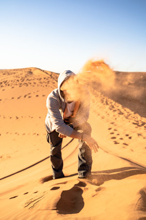 a man in the Sahara desert in North Africaの写真素材