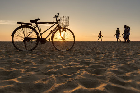 Bicycle Standing on the Beach During Sunset in Hikkaduwa, Sri Lankaの写真素材