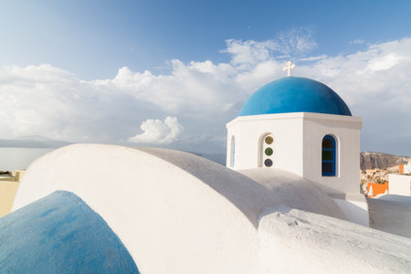 Details of a traditional Greek orthodox blue dome church, Santorini, Greeceの写真素材