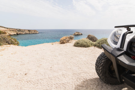 Quad bike standing on seaside road on Milos island, Greeceの写真素材