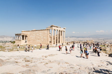 ATHENS, GREECE - MAY 2018: Tourists visiting the ruins of old temple of Athena Polias near Parthenon temple on the Acropolis of Athens, Greece.のeditorial素材