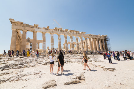 ATHENS, GREECE - MAY 2018: Tourists visiting the ruins of Parthenon temple on the Acropolis of Athens, Greece. Sunny day, wide angle lens shot.のeditorial素材