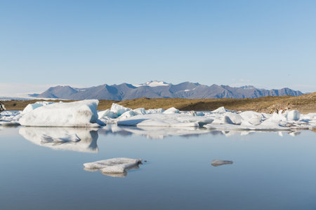 Ice floating and melting in Fjallsarlon lagoon, Iceland.の写真素材